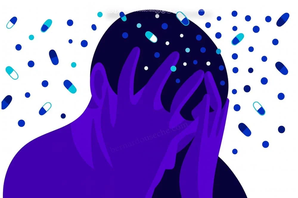 Ilustración de persona con la cabeza entre las manos rodeada de píldoras, símbolo de la salud mental en Colombia.